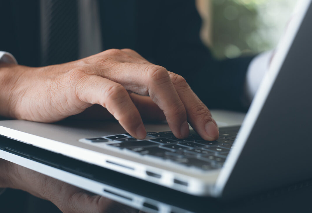 Fingers on laptop