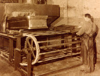 Archival photo of metal casket assembly line